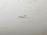 a close up of a white plate with writing on it