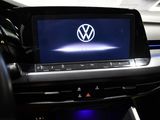 the interior of a car with a vw logo on the screen