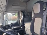 a view of the inside of a van from the driver ' s seat