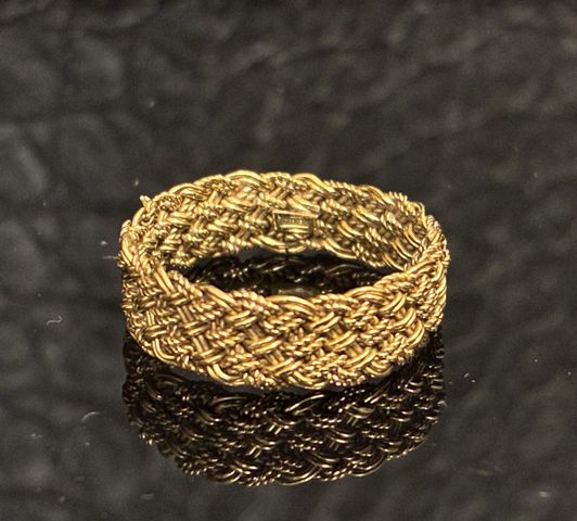 Alliance tressée en or 18 carats 750 millièmes. En règle (toléran...