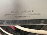 the back of a laptop computer sitting on top of a table