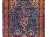 tapis persan ancien à motifs bleus et rouges