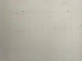 a white wall with writing on it in a room