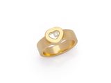 a close up of a gold ring with a heart on it