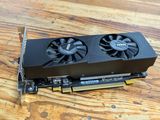 a close up of a video card sitting on top of a wooden table