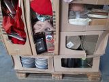 a carton filled with assorted items on top of a pallet