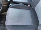 a picture of a car with a seat cover and a steering wheel