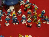 a lot of smurfs that are on the table
