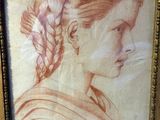 an old picture of a woman with a braid in her hair