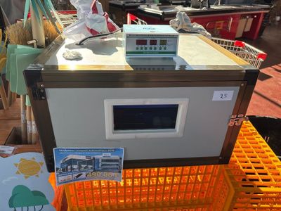 a machine that is sitting on top of an orange crate