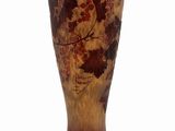 a vase that is sitting on a white surface