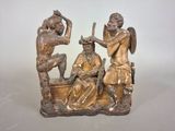 a statue of a man and a woman sitting on a bench