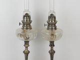 pair of antique brass candlesticks with clear glass shades