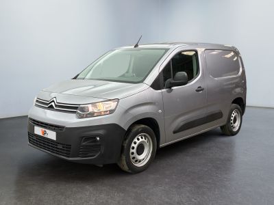 the grey van is parked in the empty room of the building