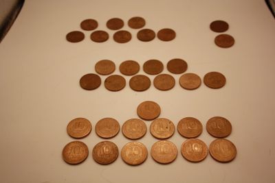 a lot of coins that are on the table