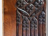an old wooden panel with a carved design on it