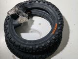 a tire that is sitting on the floor next to a box