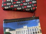 two purses that are sitting next to each other