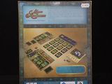 the back of a box with a game in it on a black surface