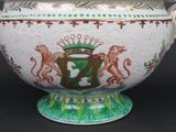 a large white bowl with a green and red design on it