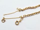 two gold chains with a clasp and a clasp on them
