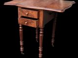 an old wooden table with two drawers and a drawer underneath it