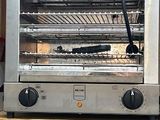 an image of a toaster oven sitting on a table
