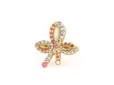 une photo d'une bague en forme de libellule sertie de diamants roses et blancs