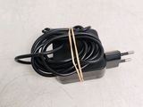 a black charger that has a cord attached to it