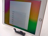 an image of a tablet computer sitting on top of a white table