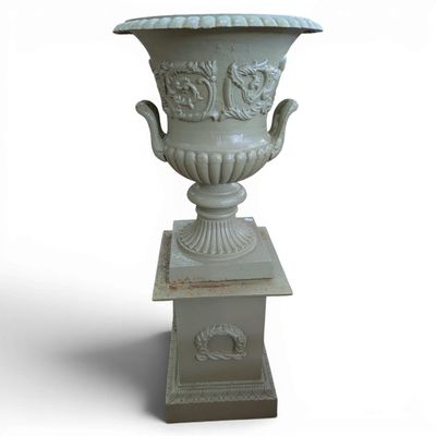 a white vase that is on a pedestal on a white background