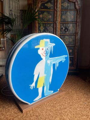 a blue sign with a picture of a man on it