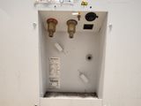 an image of a water heater that is in a wall