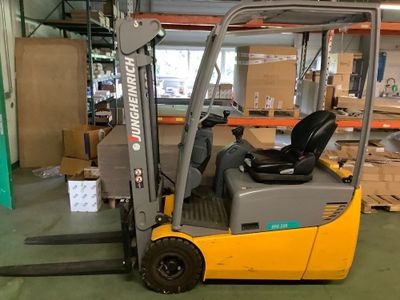 a forklift truck that is parked in a warehouse