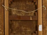 a picture of a wooden frame with a rope hanging from it