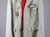 an image of a military jacket hanging on a hanger