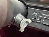 a close up of a car ' s dashboard with a steering control