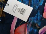 a close up of a dress with a price tag on it