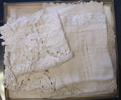 a box with a bunch of white lace on top of it