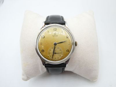 an image of a wrist watch on a pillow on a white surface