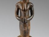 an image of a statue of a woman holding a baby