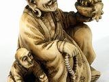 an image of a figurine of a man with a bird in his hand