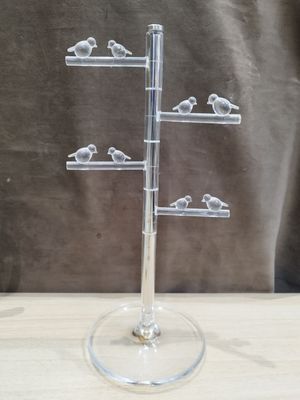 a glass display with birds on it on a table