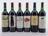 six bouteilles de vin sont alignées sur une table