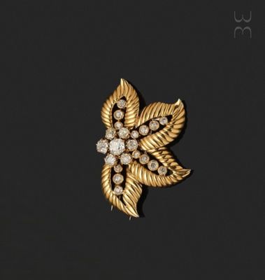 an image of a gold and diamond broochle