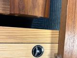 a close up of a drawer with a clock on it