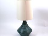 a lamp that is sitting on a table with a lamp on top of it