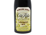 a bottle of wine that is sitting on a table