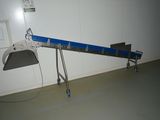 a picture of a conveyor belt in a warehouse