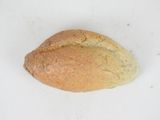 a piece of bread that is sitting on a white surface